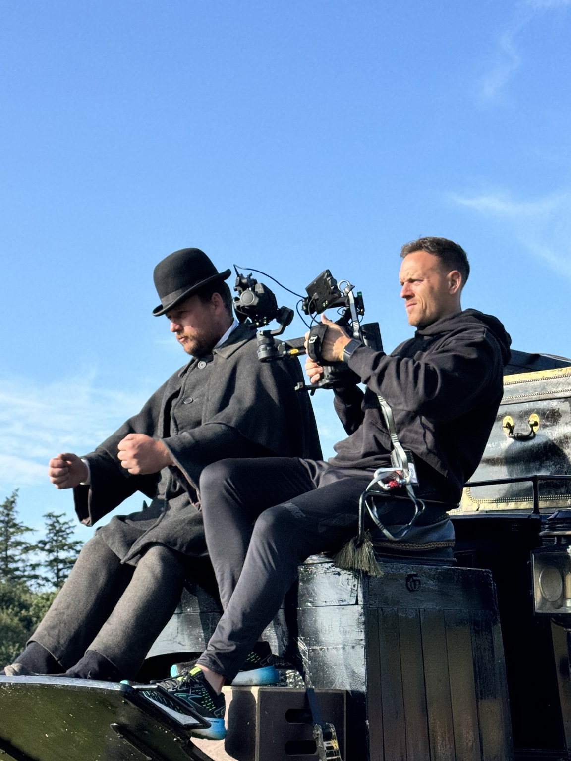 Adam Brashaw filming from the top of a carriage on Young Sherlock.