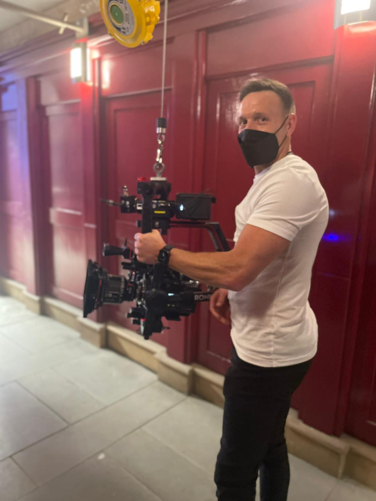 Adam Brashaw operating camera in an alley on The Union.